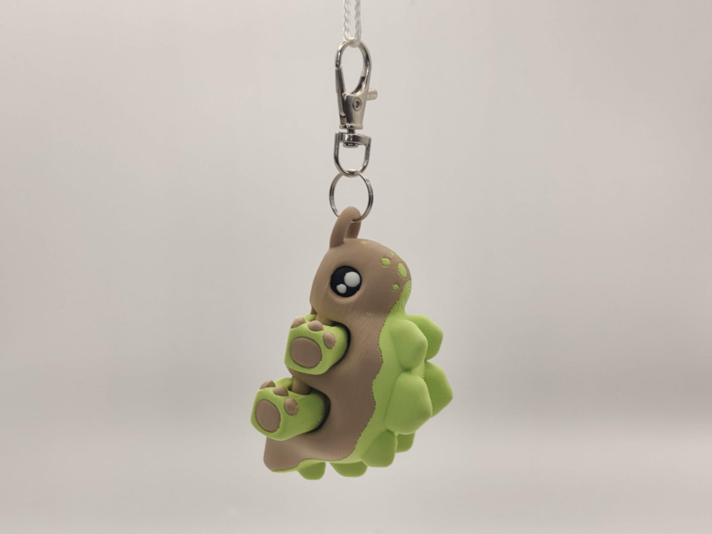 3D Printed Stegosaurus Dinosaur Keychain – Cute Articulated Dino Bag Charm