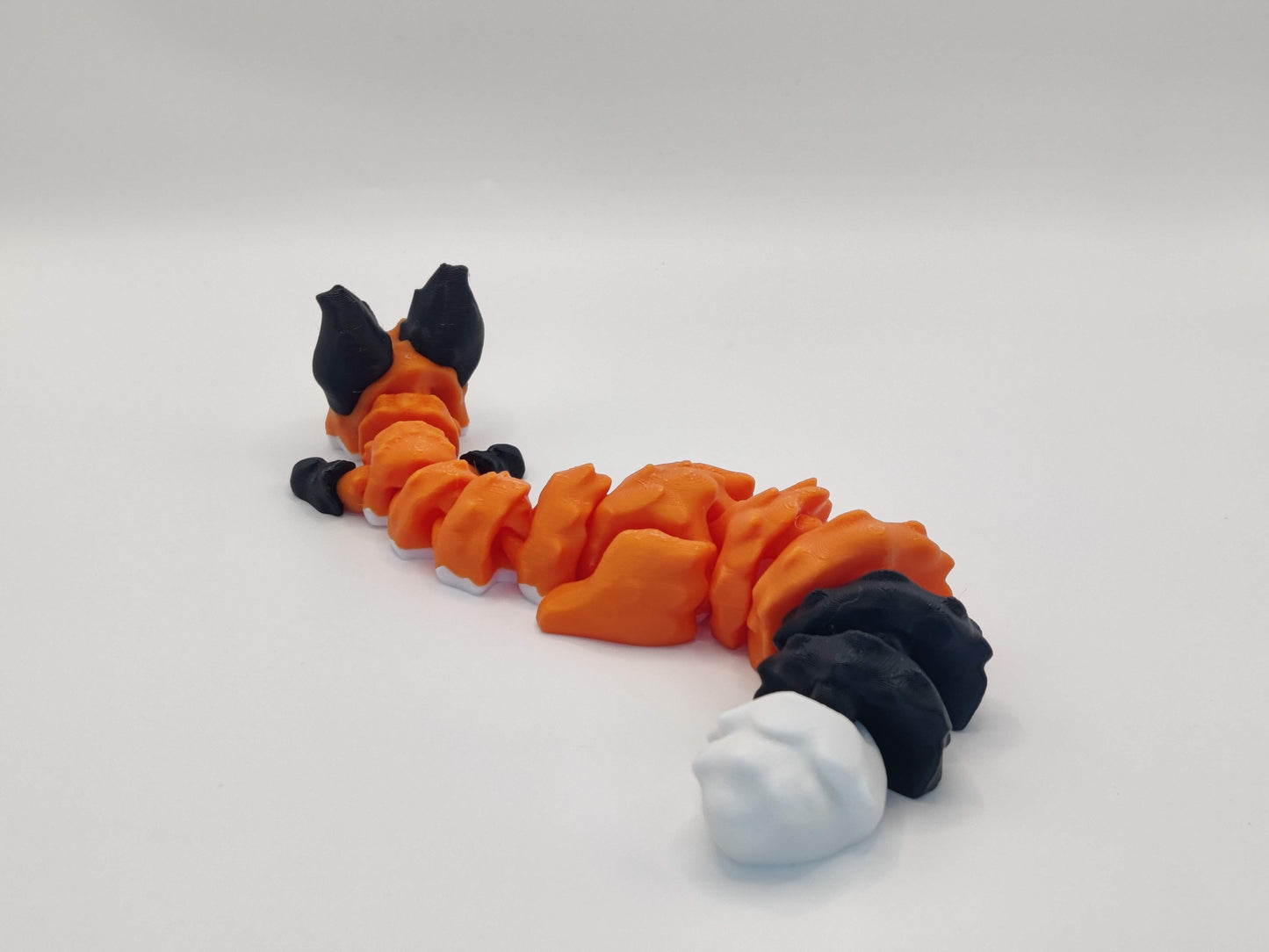 3D Printed Articulated Fox Figure in Orange Black and White