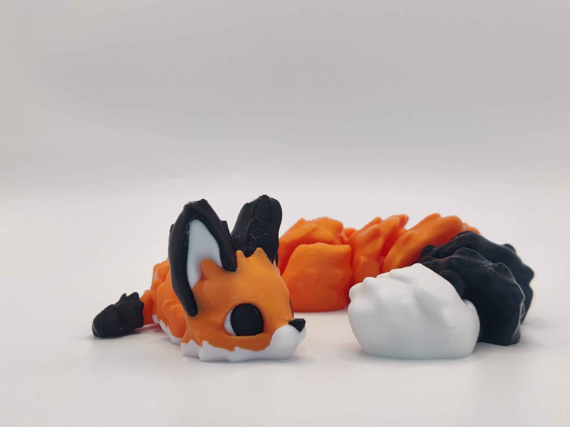 3D Printed Articulated Fox Figure in Orange Black and White - ToyForge 3D