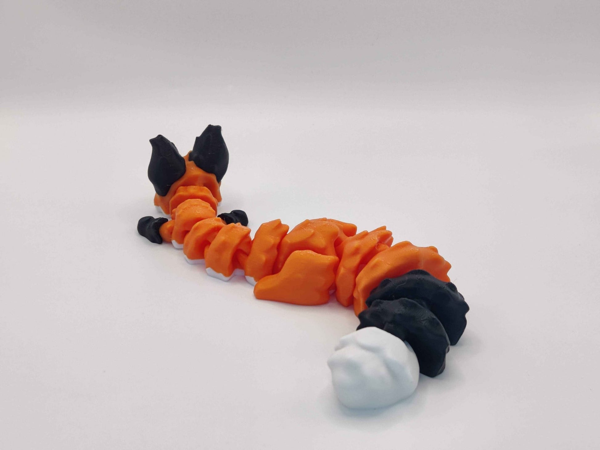 3D Printed Articulated Fox Figure in Orange Black and White - ToyForge 3D