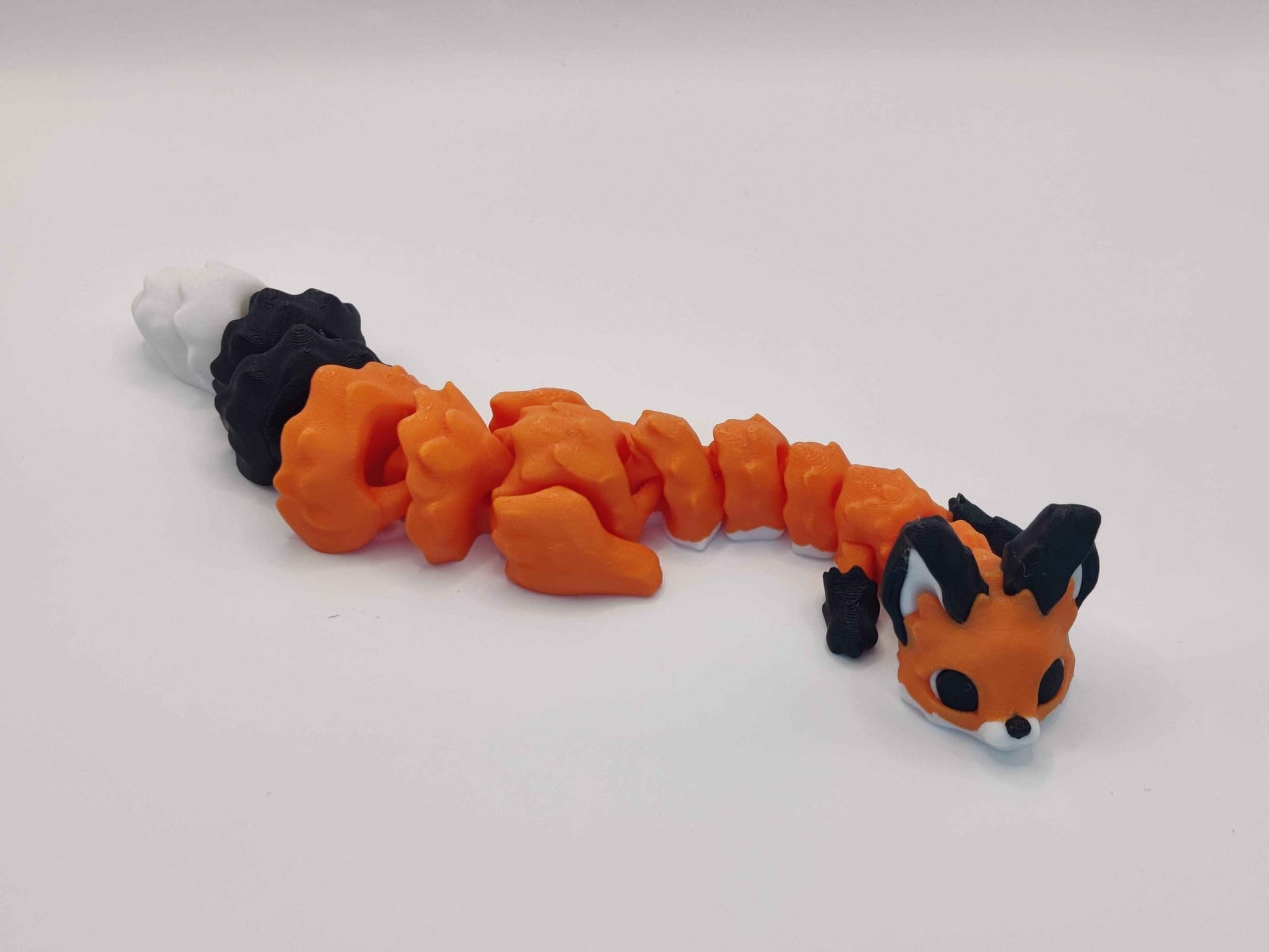 3D Printed Articulated Fox Figure in Orange Black and White - ToyForge 3D