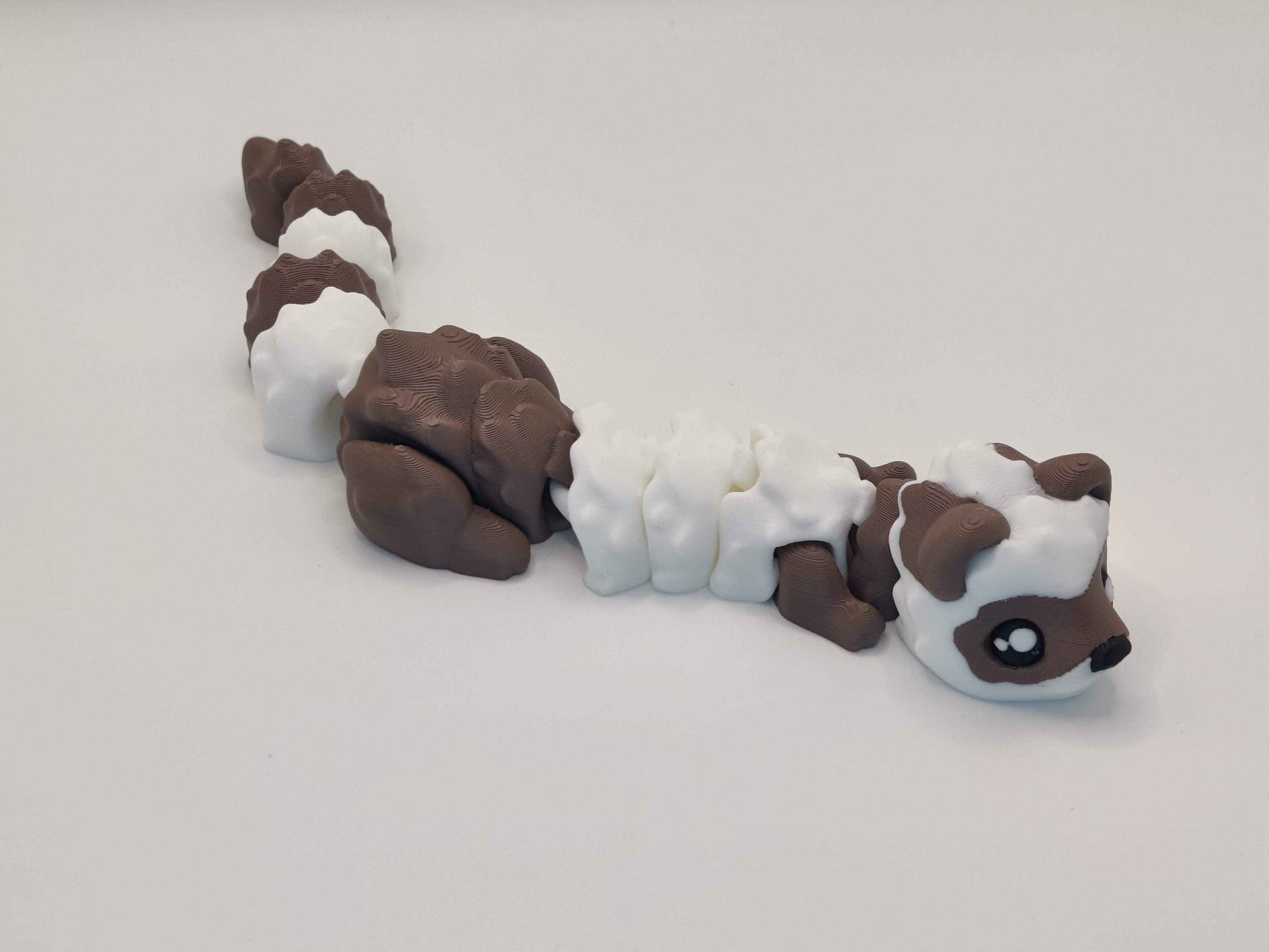 3D Printed Hot Cocoa Ferret Figurine in Brown and White - ToyForge 3D