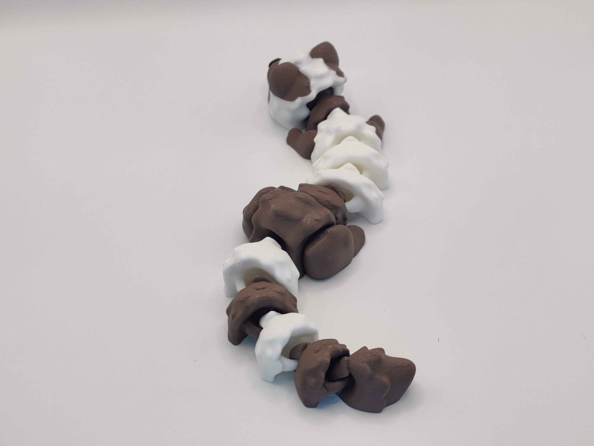 3D Printed Hot Cocoa Ferret Figurine in Brown and White - ToyForge 3D