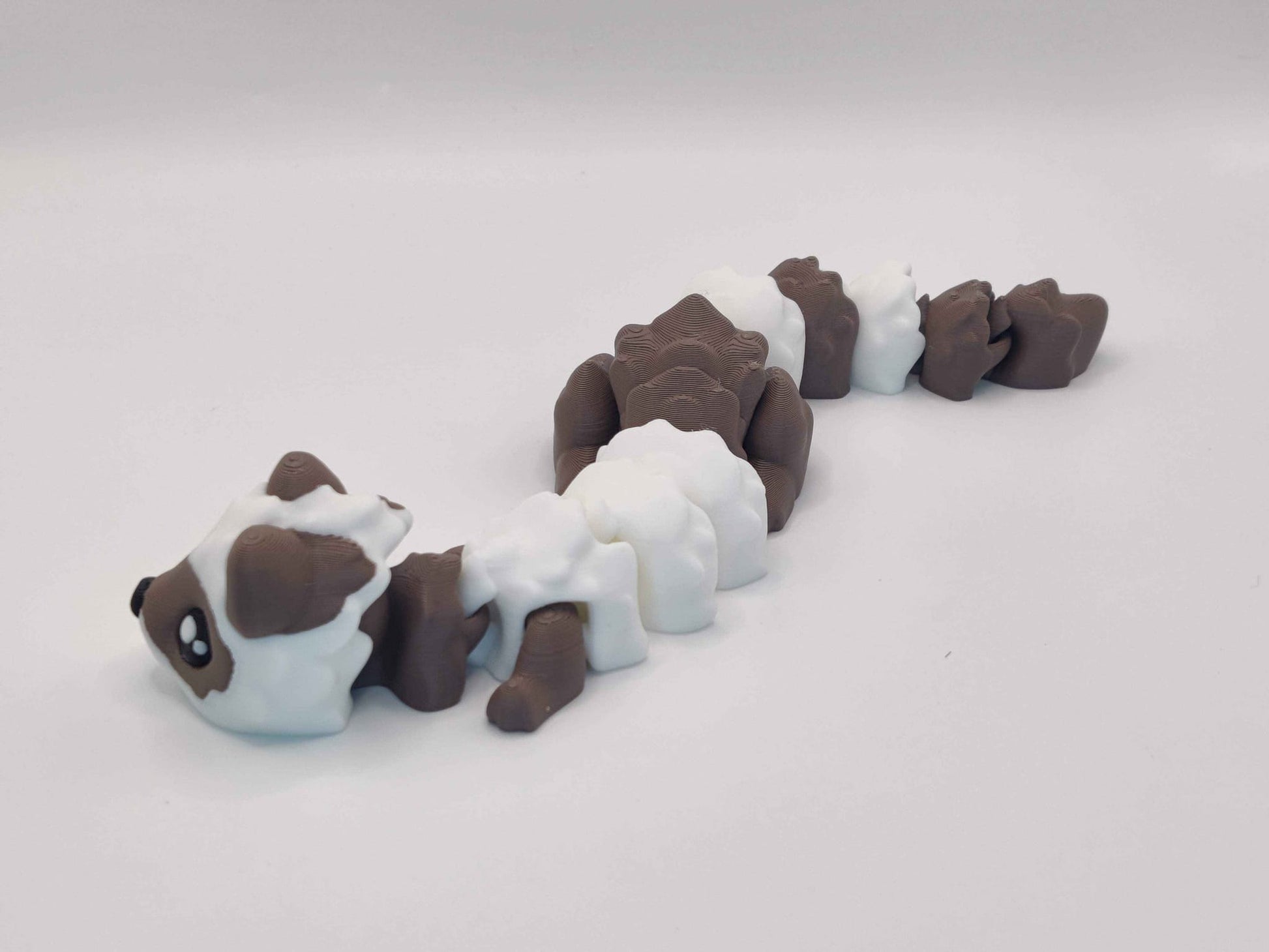 3D Printed Hot Cocoa Ferret Figurine in Brown and White - ToyForge 3D