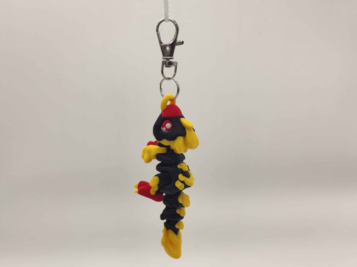 3D Printed Raptor Dinosaur Keychain – Cute Prehistoric Dino Bag Charm - ToyForge 3D
